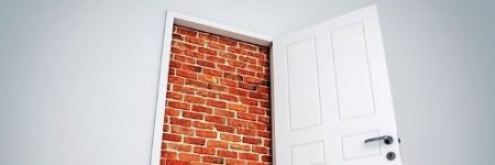 door with brick wall behind it